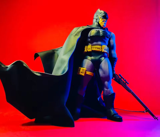Superhero figure with cape and weapon on a red and pink gradient background Batman: The Dark Knight Returns "Night Ranger" Collectible Action Figure by Joy Man Toys (JM004)
