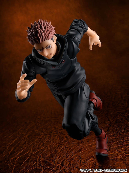 Action figure of a character in black outfit with red hair on a brown textured background Jujutsu Kaisen S.H.Figuarts Yuji Itadori Authentic 15cm Articulated Action Figure – Sukuna Vessel Edition