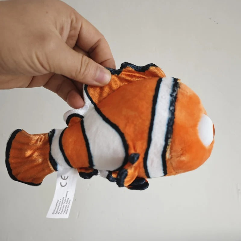 A plush toy fish with an orange body, white stripes, and black outlines, being held by a person's hand against a plain light background. Official Finding Nemo & Dory Premium Best Friends Plush by Titantoons side