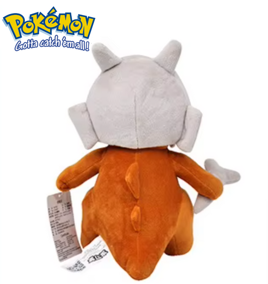Plush toy of a character from Pokémon with a white hat and orange body on a white background. Official Pokémon Cubone Premium Cotton Plush by Titantoons – 10-Inch