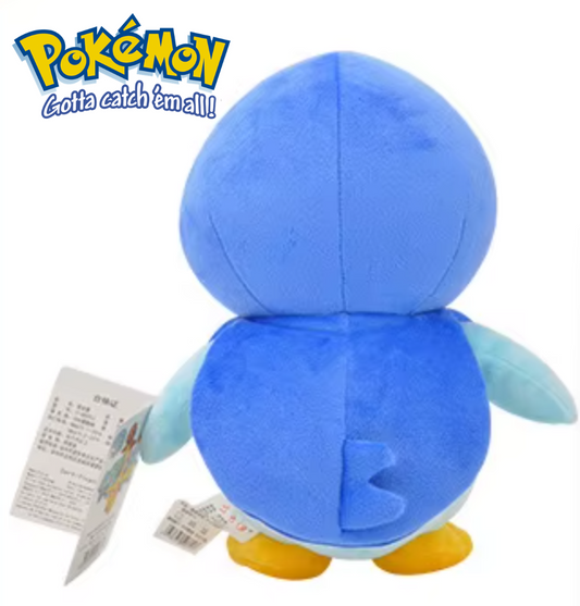 Blue plush toy with yellow feet on a white background, featuring the Pokémon logo. Official Pokémon Piplup Premium Cotton Plush by Titantoons – 10-Inch