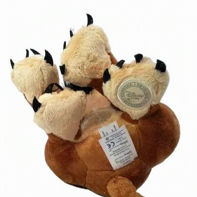 A Disney-themed plush toy shaped like a lion cub's paws and body, featuring beige plush paws with black claws and a brown plush body, shown on a white background with a visible Disney tag. Official The Lion King Scar Premium Cotton Plush by Titantoons bottom