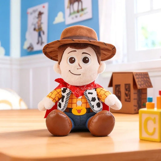 A Woody the Toy plush doll sitting on a wooden table in a brightly lit children's room. Woody is wearing his signature cowboy hat, red bandana, yellow plaid shirt, blue pants, and brown boots. Official Toy Story & Playroom Friends Premium Cotton Plush Collection by Titantoons