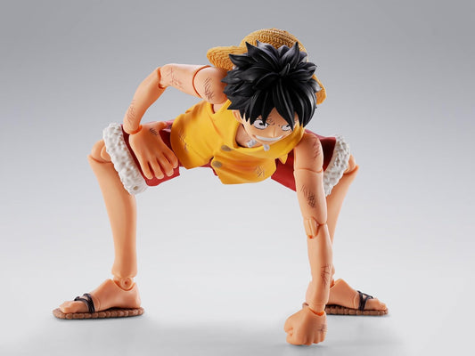Action figure of a character in a dynamic pose on a gray background One Piece: Monkey D. Luffy (Summit War of Marineford Ver.) Authentic S.H. Figuarts Fully Articulated Action Figure by Bandai Spirits