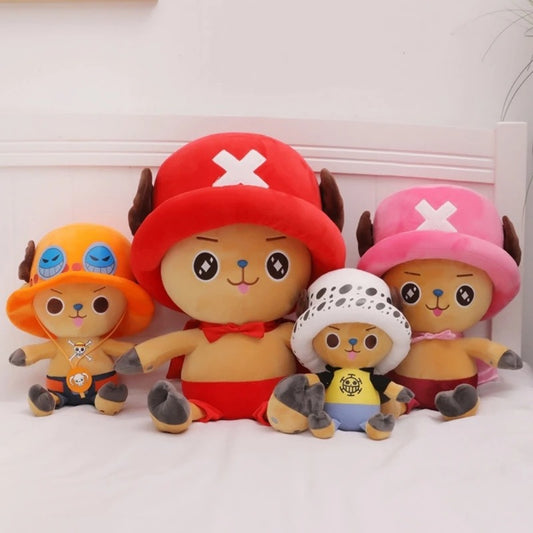 Four colorful plush toys with unique hats on a white background One Piece: Tony Tony Chopper Luxury Character Plush