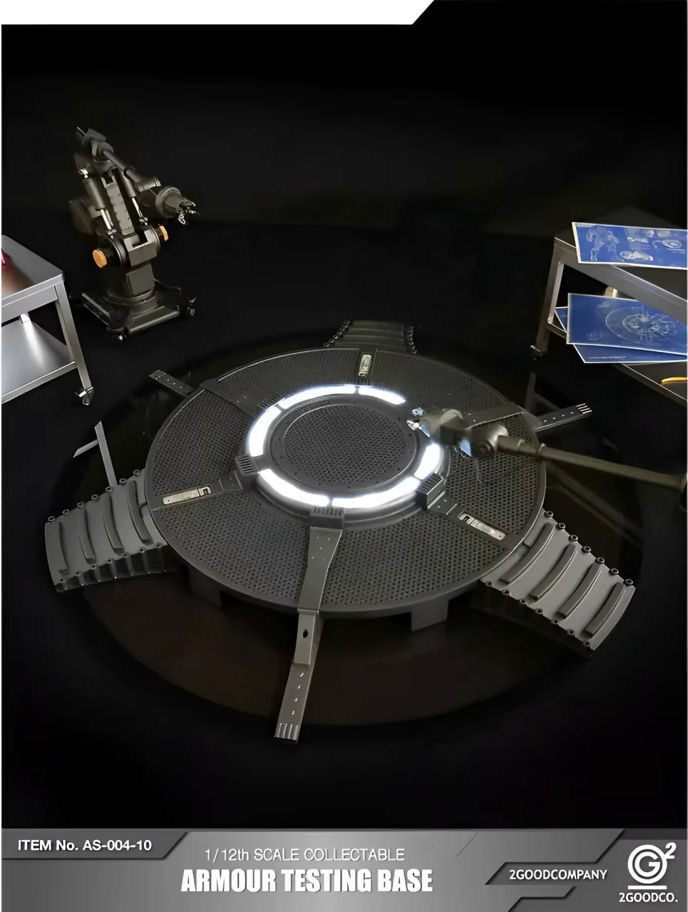 Model of an armour testing base with glowing center on a dark background, featuring 2goodcompany branding. 2GOODCO 1/12 Scale LED Light Armor Testing Base Workshop Mechanical Diorama Set