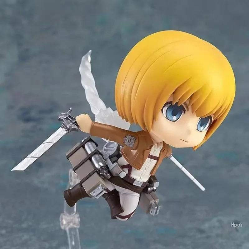 Action figure with blonde hair and a sword on a gray background Attack on Titan: Armin Arlert (Q-Clay Series) Fully Articulated Action Figure with Interchangeable Faceplates
