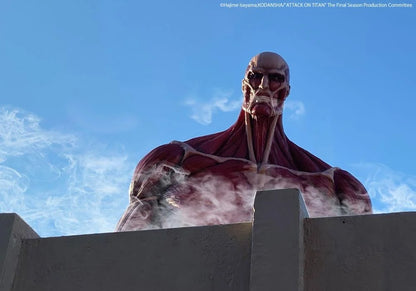 Large creature resembling a Titan from 'Attack on Titan' standing behind a wall with a blue sky in the background. Attack on Titan: Bertholdt Hoover - The Colossal Titan Mega Sofvi Advance MS021 Premium Vinyl Figure by Kaiyodo