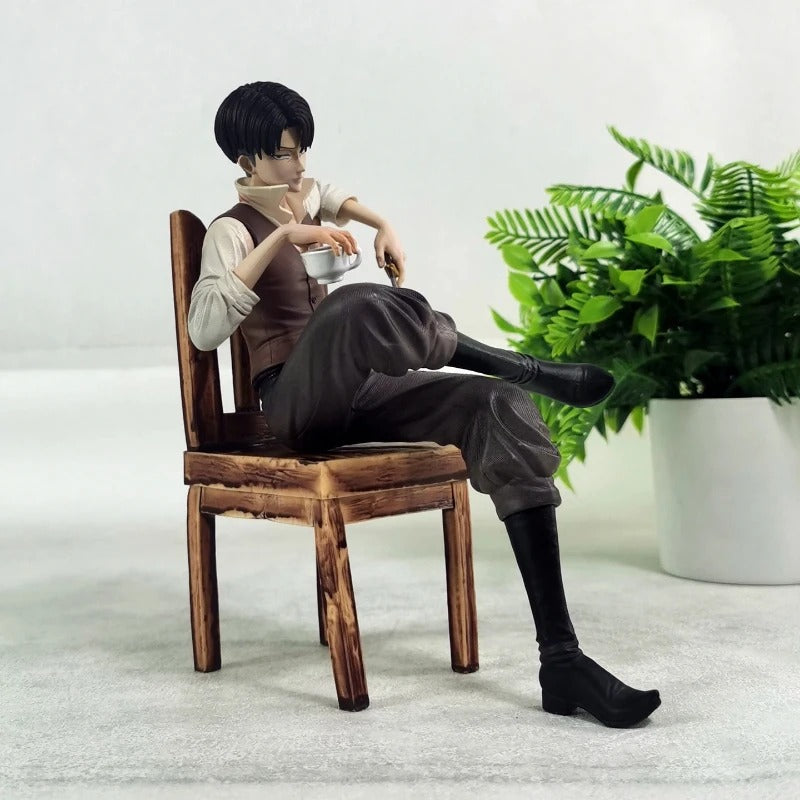 Figure sitting on a wooden chair with a plant in the background Attack on Titan: Captain Levi Ackerman (Side Story Series No.1 - Tea Time) 19cm Premium Resin Statue by TITAN Studio