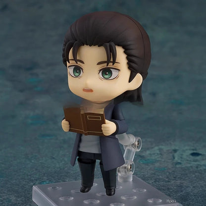 Figurine of a character holding a book against a dark blue background Attack on Titan: Eren Jaeger (The Final Season - Nendoroid No.2000) Authentic Fully Articulated Chibi Figure by Good Smile Company