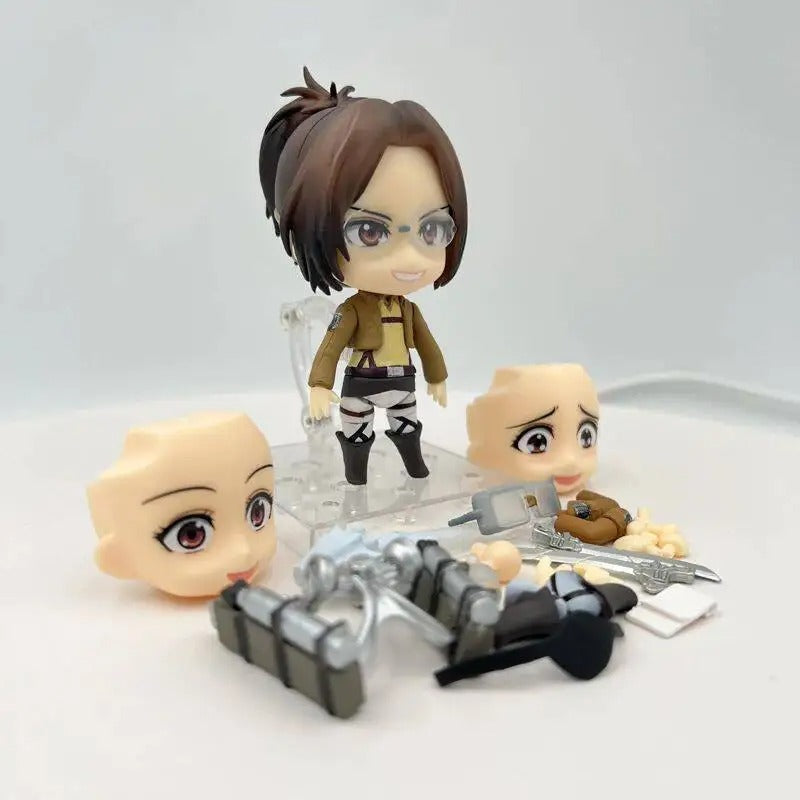 Figurines of animated characters with accessories on a white background Attack on Titan: Hange Zoë (Nendoroid No.1123) Authentic Fully Articulated Premium Chibi Figure by Good Smile Company