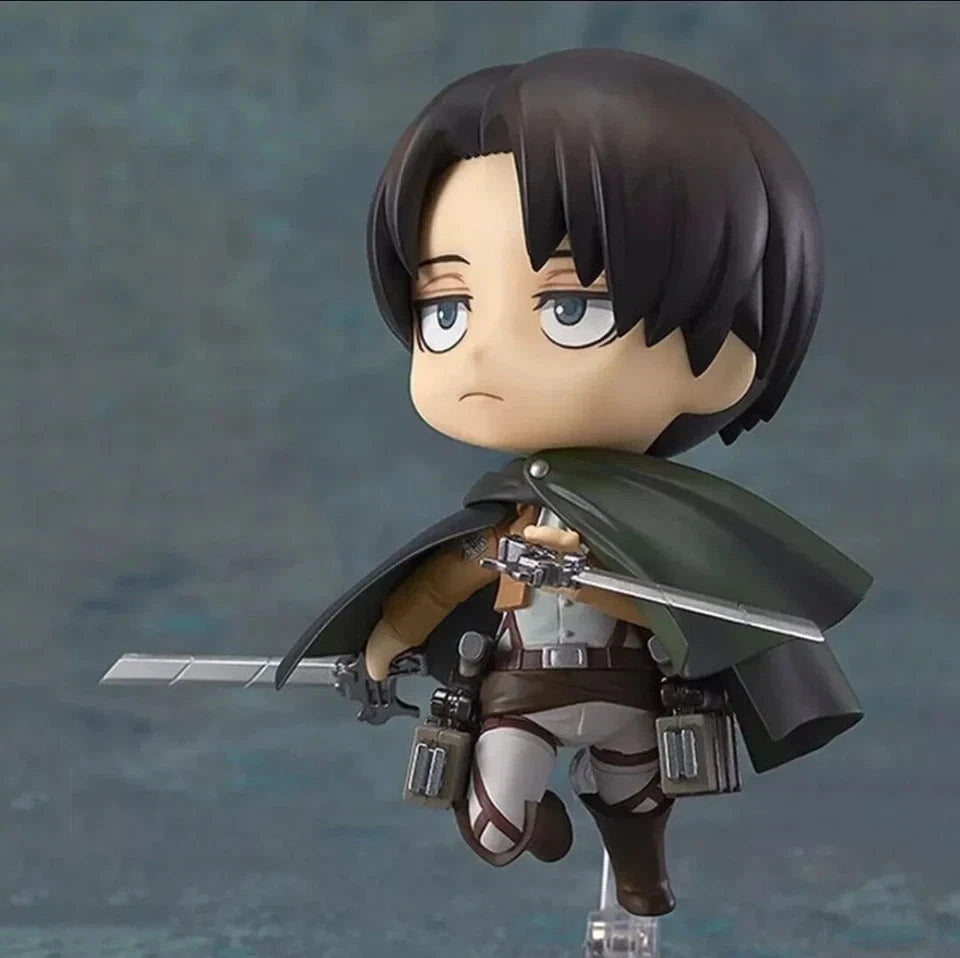 Action figure with a sword on a gray background Attack on Titan: Levi Ackerman (Nendoroid No.390) Authentic Fully Articulated Premium Chibi Figure by Good Smile Company