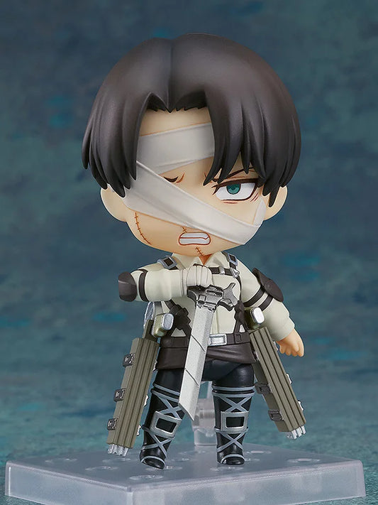 Action figure with bandaged face and weapons on a blue background Attack on Titan: Levi Ackerman (The Final Season - Nendoroid No.2002) Authentic Fully Articulated Chibi Figure by Good Smile Company