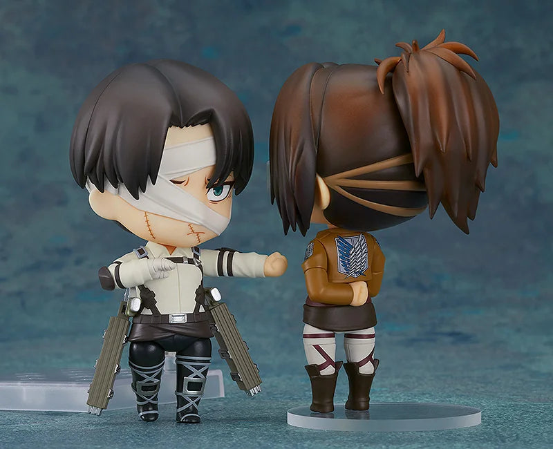 Two figurines with bandages and weapons on a blue background Attack on Titan: Levi Ackerman (The Final Season - Nendoroid No.2002) Authentic Fully Articulated Chibi Figure by Good Smile Company
