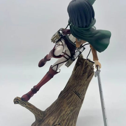 Anime character figurine on a tree stump with a gray background Attack on Titan: Mikasa Ackerman (ArtFX J Renewal Package Ver.) 1/8 Scale Premium Statue by Kotobukiya