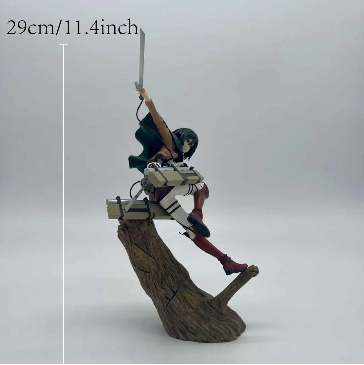 Figure on a log with measurement label '29cm/11.4inch' on a white background Attack on Titan: Mikasa Ackerman (ArtFX J Renewal Package Ver.) 1/8 Scale Premium Statue by Kotobukiya