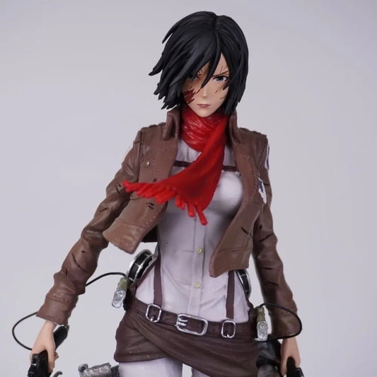 Action figure with a brown jacket and red scarf on a white background Attack on Titan: Mikasa Ackerman (Battle Damaged / Scout Uniform) Premium Scale Figure Statue by SanSan Studio