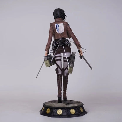 Statue of a character from a popular anime or manga series on a white background Attack on Titan: Mikasa Ackerman (Battle Damaged / Scout Uniform) Premium Scale Figure Statue by SanSan Studio