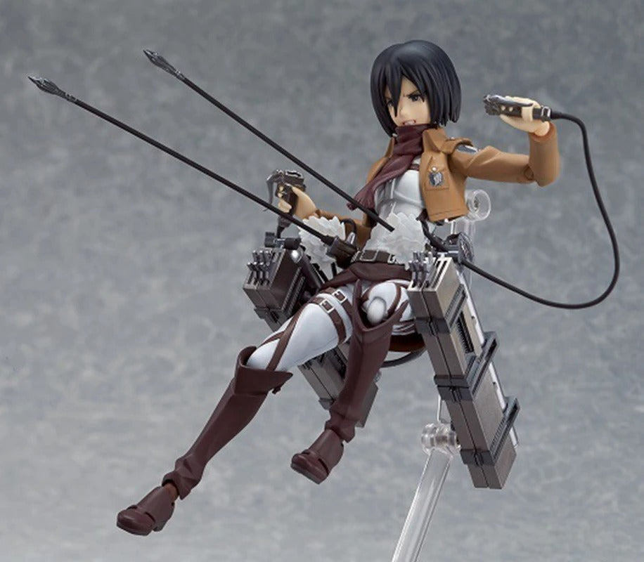 Action figure of a character from an anime with weapons on a gray backgroundb Attack on Titan: Mikasa Ackerman (Figma No.203) Highly Poseable Premium Action Figure by Max Factory