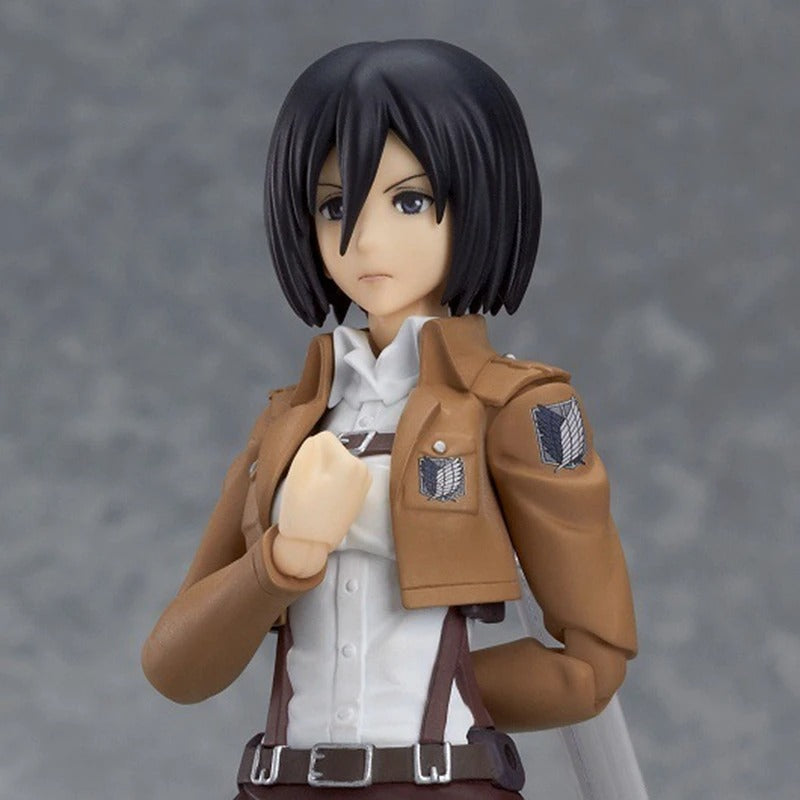 Figurine of a character in a brown jacket with patches on a gray background Attack on Titan: Mikasa Ackerman (Figma No.203) Highly Poseable Premium Action Figure by Max Factory