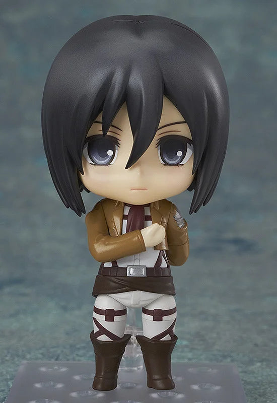 Action figure with dark hair and a brown outfit on a gray background Attack on Titan: Mikasa Ackerman (Nendoroid No.365) Authentic Fully Articulated Premium Chibi Figure by Good Smile Company