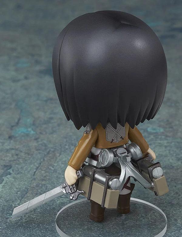 Figurine with dark hair and armor on a textured gray background Attack on Titan: Mikasa Ackerman (Nendoroid No.365) Authentic Fully Articulated Premium Chibi Figure by Good Smile Company