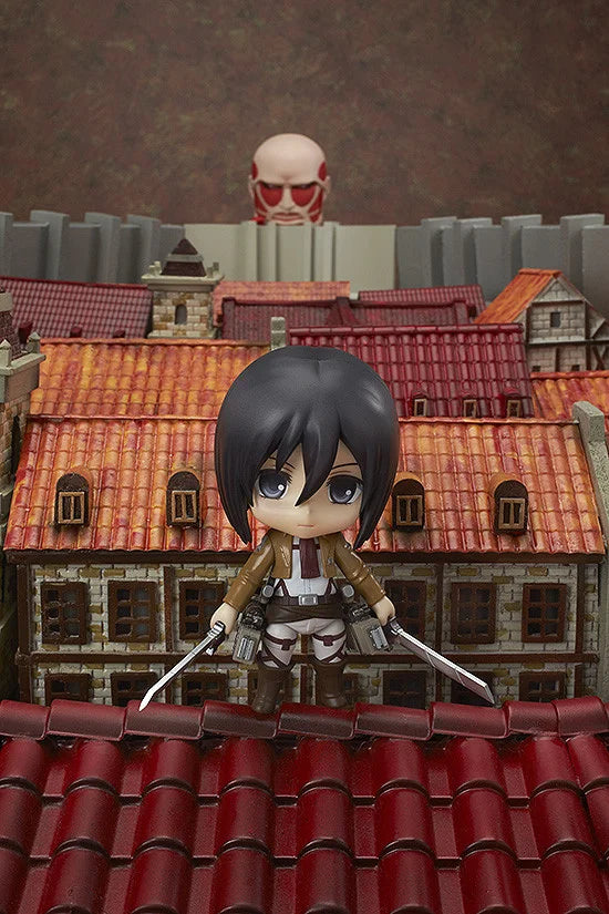 Figurine on a rooftop with a cityscape background Attack on Titan: Mikasa Ackerman (Nendoroid No.365) Authentic Fully Articulated Premium Chibi Figure by Good Smile Company