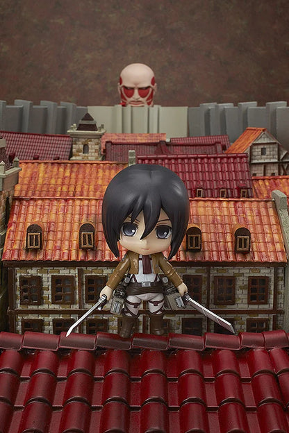Figurine on a rooftop with a cityscape background Attack on Titan: Mikasa Ackerman (Nendoroid No.365) Authentic Fully Articulated Premium Chibi Figure by Good Smile Company