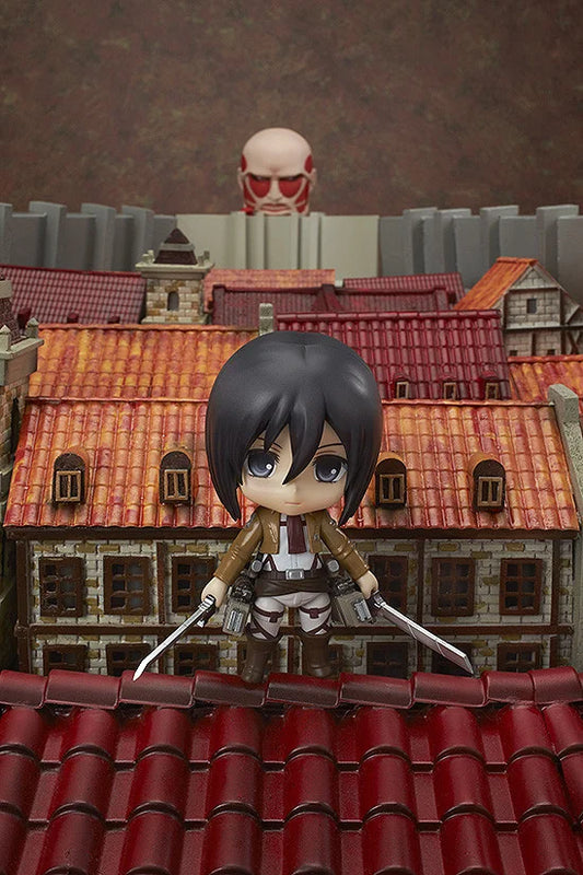 Figurine on a rooftop with a cityscape background Attack on Titan: Mikasa Ackerman (Nendoroid No.365) Authentic Fully Articulated Premium Chibi Figure by Good Smile Company