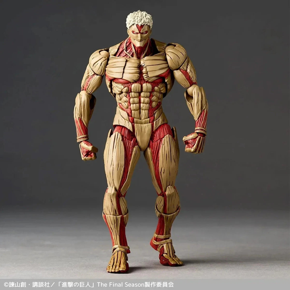 Action figure with beige and red design on a gray background Attack on Titan: Reiner Braun - The Armored Titan Amazing Yamaguchi No.042 Revoltech Action Figure by Kaiyodo