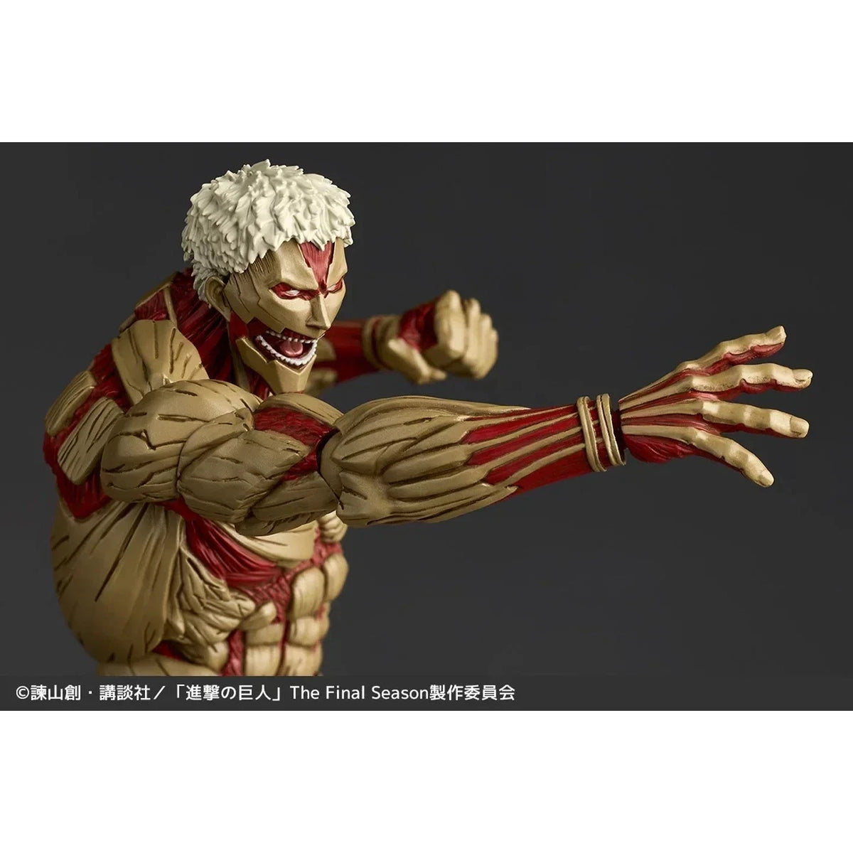 Action figure of a character with white hair and red accents on a dark background Attack on Titan: Reiner Braun - The Armored Titan Amazing Yamaguchi No.042 Revoltech Action Figure by Kaiyodo
