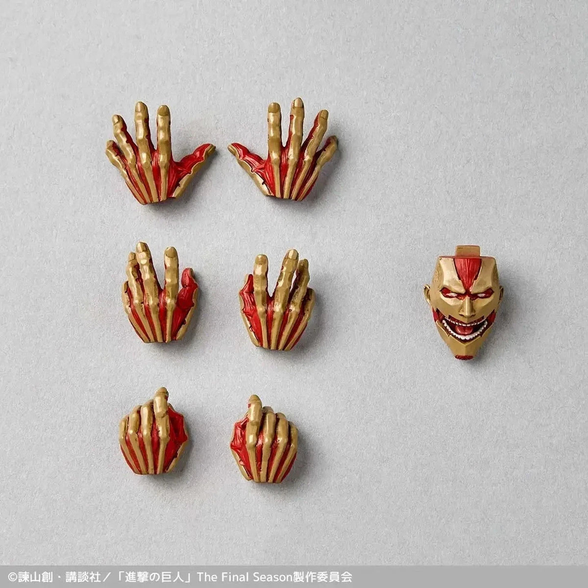 Set of gold and red character accessories on a gray background Attack on Titan: Reiner Braun - The Armored Titan Amazing Yamaguchi No.042 Revoltech Action Figure by Kaiyodo