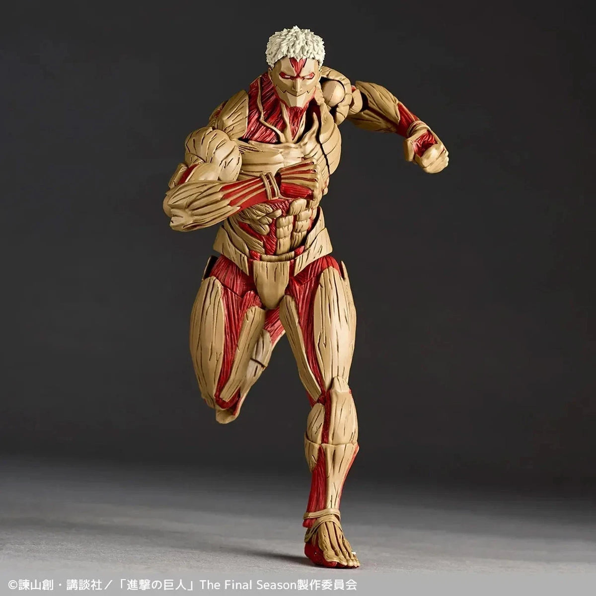 Action figure with detailed musculature on a dark background Attack on Titan: Reiner Braun - The Armored Titan Amazing Yamaguchi No.042 Revoltech Action Figure by Kaiyodo
