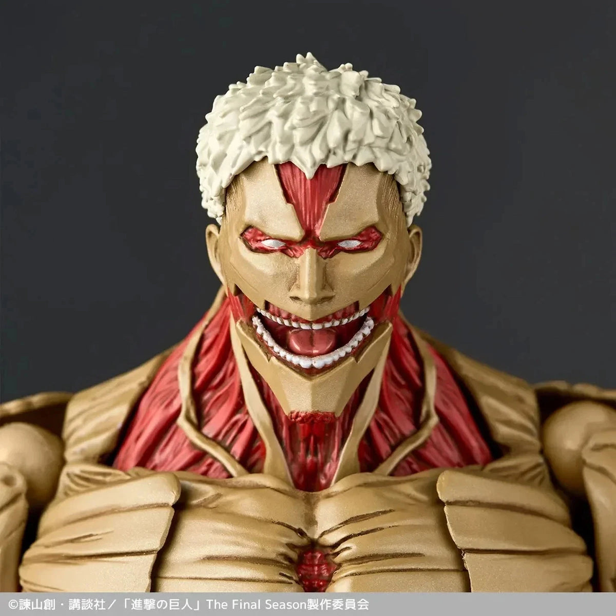 Close-up of a detailed action figure with a dark background Attack on Titan: Reiner Braun - The Armored Titan Amazing Yamaguchi No.042 Revoltech Action Figure by Kaiyodo