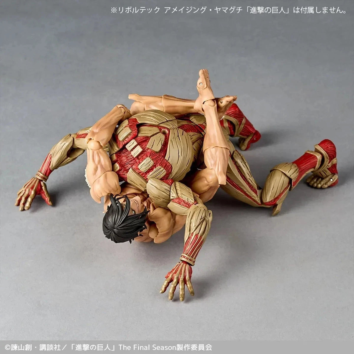 Action figure of a character in a dynamic pose on a gray background Attack on Titan: Reiner Braun - The Armored Titan Amazing Yamaguchi No.042 Revoltech Action Figure by Kaiyodo