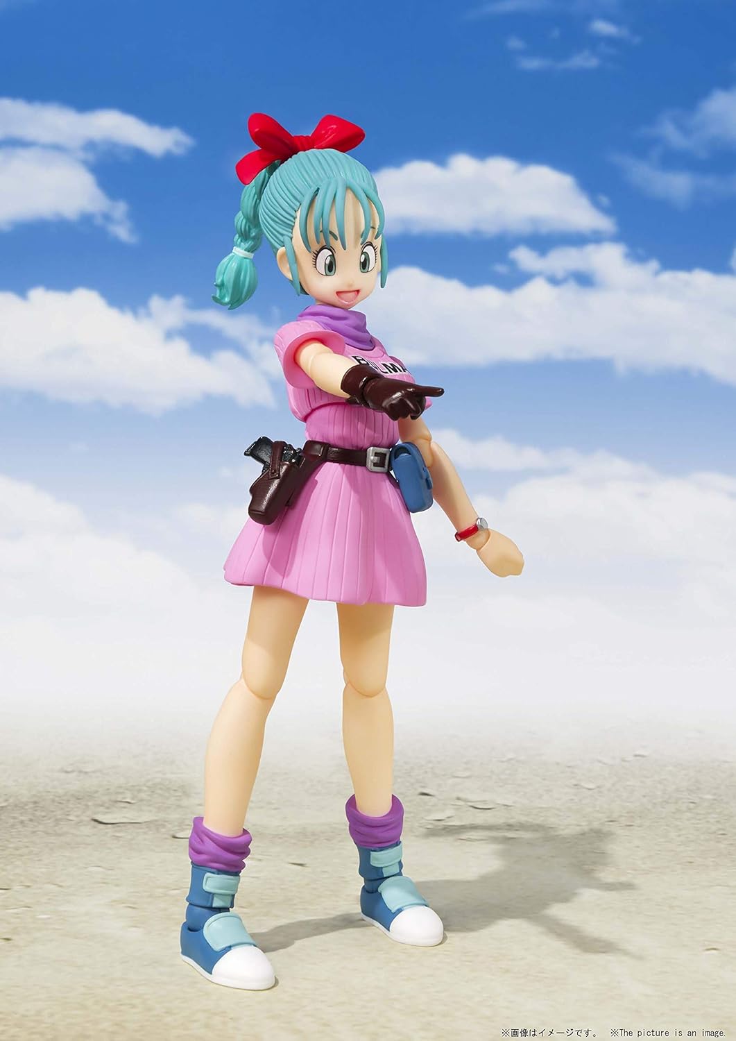 Action figure with colorful outfit and accessories against a blue sky with clouds Bandai S.H.Figuarts Dragon Ball: Bulma -Adventure Begins- Authentic Premium Action Figure 4
