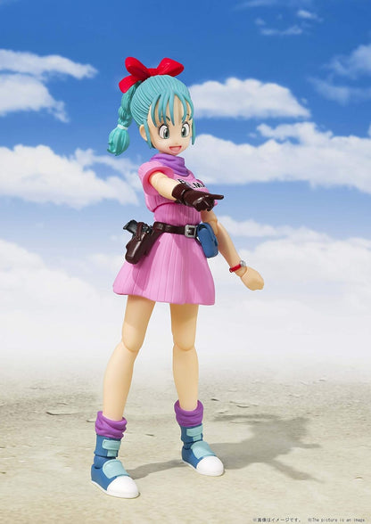 Action figure with colorful outfit and accessories against a blue sky with clouds Bandai S.H.Figuarts Dragon Ball: Bulma -Adventure Begins- Authentic Premium Action Figure 4
