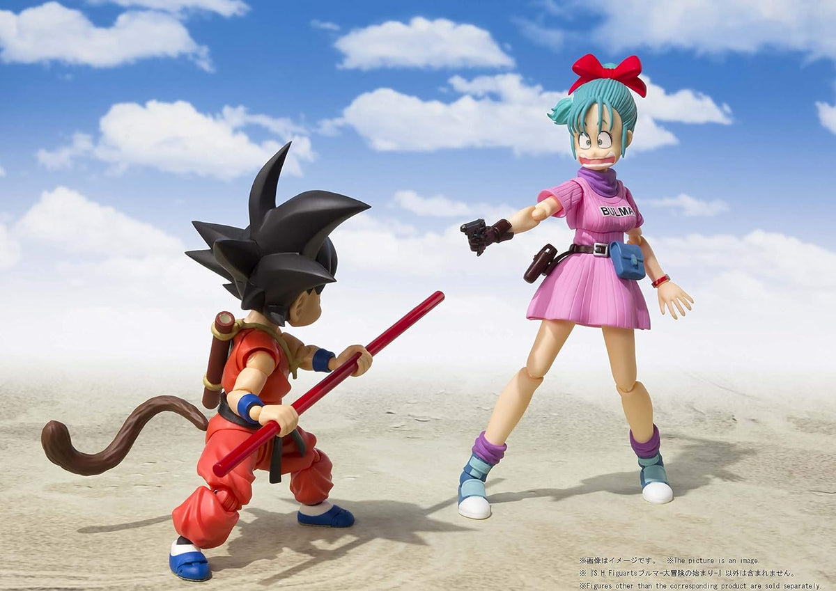 Two action figures in a desert setting with a blue sky. Bandai S.H.Figuarts Dragon Ball: Bulma -Adventure Begins- Authentic Premium Action Figure