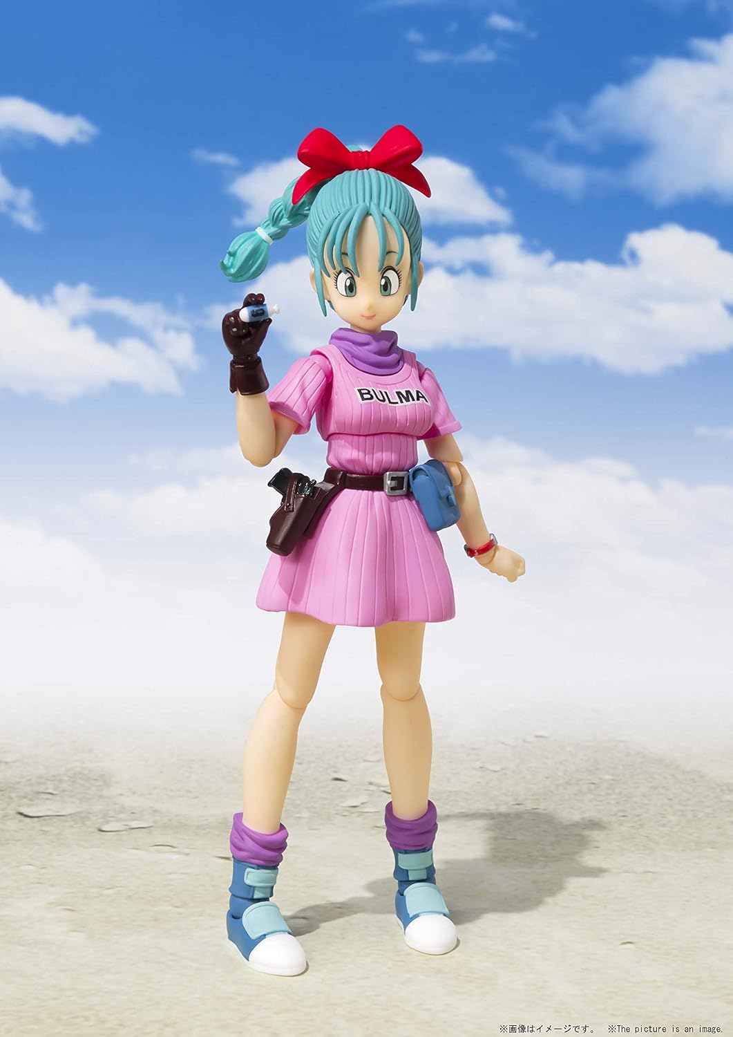Action figure of Bulma from Dragon Ball Z against a blue sky with clouds Bandai S.H.Figuarts Dragon Ball: Bulma -Adventure Begins- Authentic Premium Action Figure
