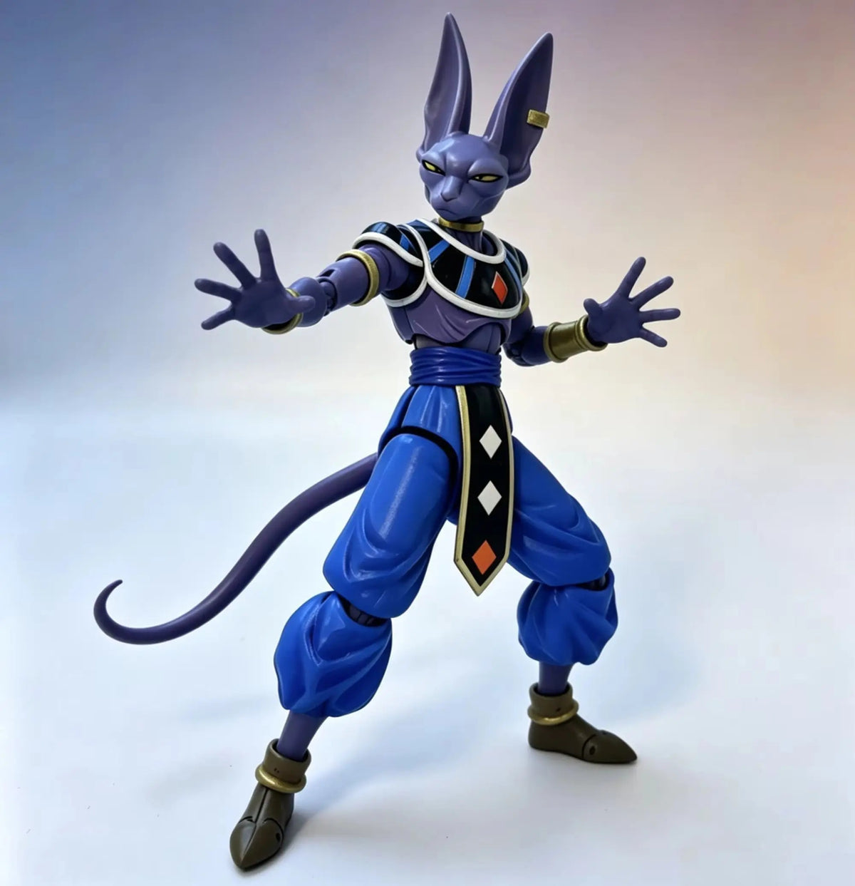 Action figure of a character in blue and purple costume with a white background Bandai S.H.Figuarts Dragon Ball Super: God of Destruction Beerus Authentic Premium Action Figure