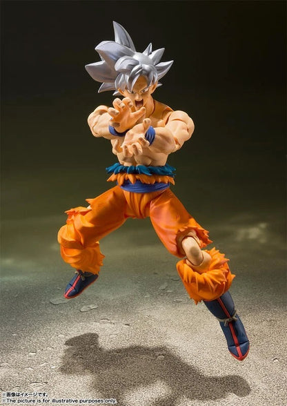 Action figure in dynamic pose on a textured surface with a dark background Bandai S.H.Figuarts Dragon Ball Super: Son Goku (Ultra Instinct) Authentic Premium Action Figure