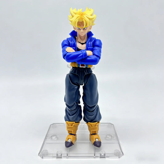 Action figure with blue outfit and yellow hair on a clear stand against a white background Bandai S.H.Figuarts Dragon Ball Z: Super Saiyan Trunks Authentic Premium Action Figure