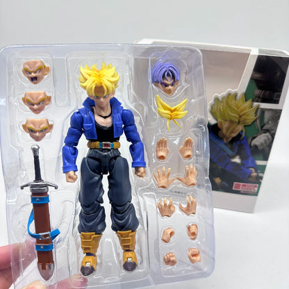 Action figure in packaging with interchangeable parts on a white background Bandai S.H.Figuarts Dragon Ball Z: Super Saiyan Trunks Authentic Premium Action Figure