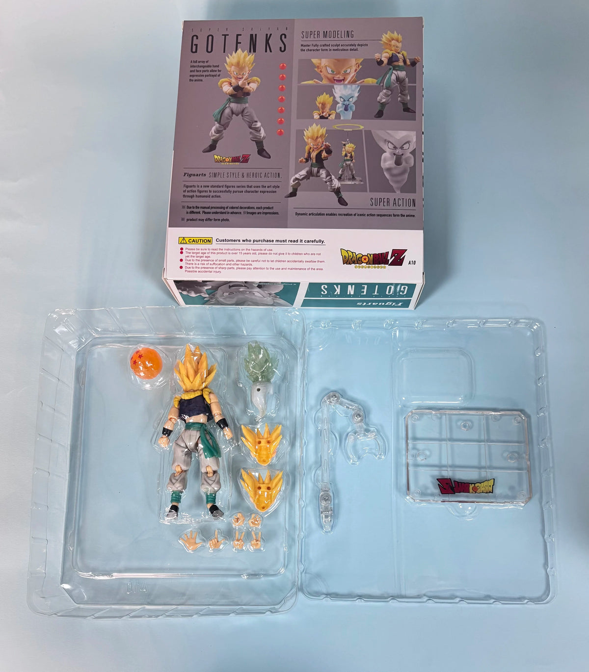 Action figure with packaging and accessories on a light gray background Bandai S.H.Figuarts Dragon Ball Z/Super: Super Saiyan Gotenks Authentic Premium Action Figure
