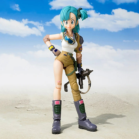 Action figure with green hair and futuristic outfit standing on a sandy surface with a blue sky. Bandai S.H.Figuarts Original Dragon Ball: Bulma Authentic Premium Action Figure 1