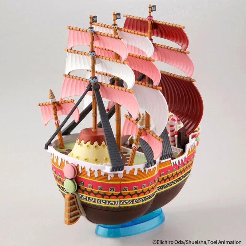 Colorful model ship with multiple masts and sails on a gray background Bandai Spirits Hobby One Piece Grand Ship Collection: Queen Mama Chanter – Authentic Scale Model Kit (Big Mom Pirates Flagship)