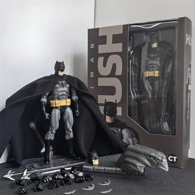 Batman action figure with packaging and accessories on a gray surface Batman: Hush (Black Version) 1/12 Scale Collectible Action Figure by CT Toys