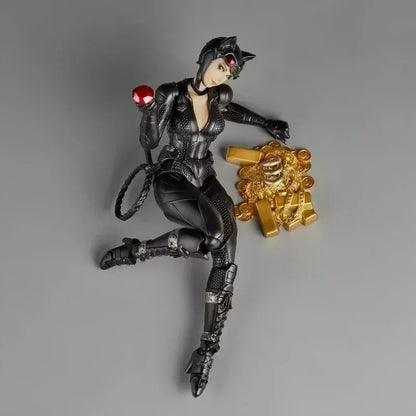 Action figure in black costume with red eyes and gold object on gray background Catwoman (Selina Kyle) Amazing Yamaguchi 1/12 Scale Action Figure by Kaiyodo