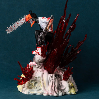 Statue of a character with a chainsaw on a dark blue background. Chainsaw Man Denji 29cm Battle Scene Authentic Diorama Figure – Premium Visceral Gore & Translucent Blood Splatter Extra-Large Collectible Character Statue