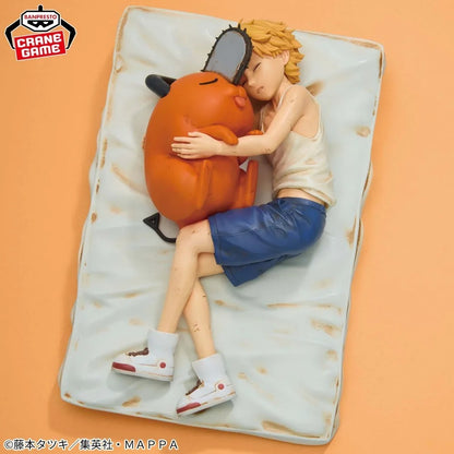 Figurine of a person hugging an orange creature on a textured surface with 'CRANE GAME' branding. Chainsaw Man Denji & Pochita Authentic Break Time Collection Vol.4 Fixed-Pose Sleep Scenario Statue by Bandai Banpresto